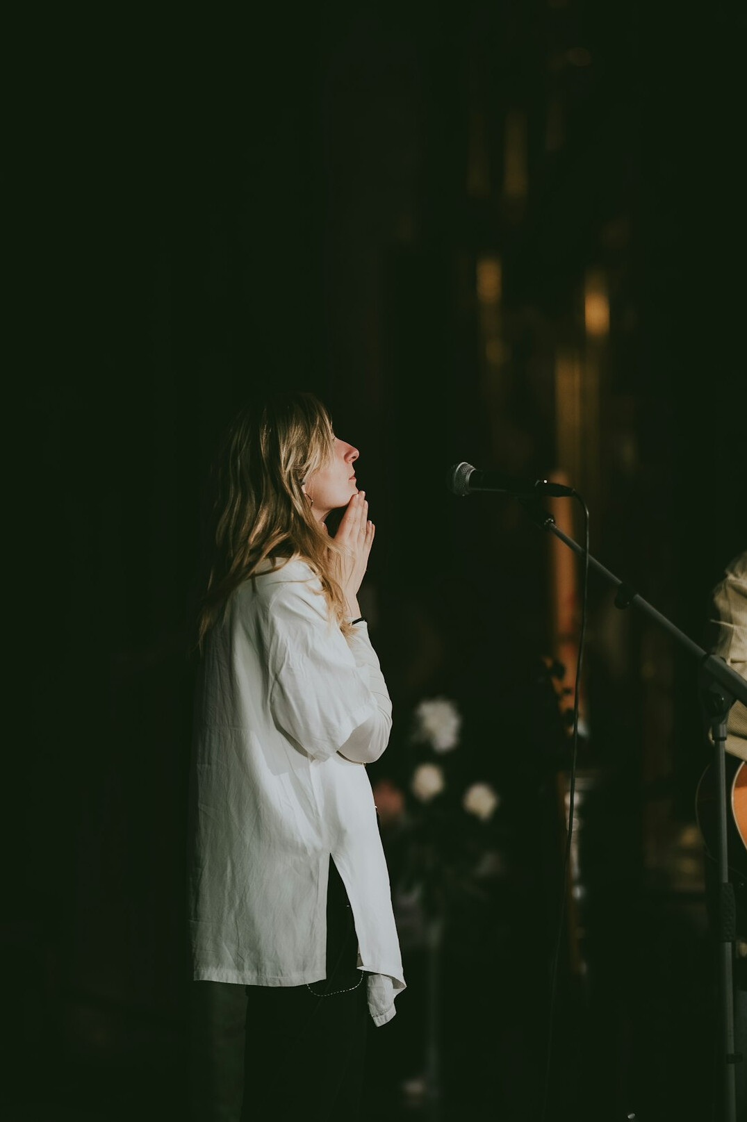 woman speaking confidently on stage