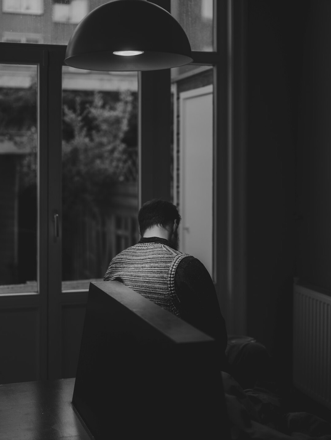 person reflecting alone in quiet room