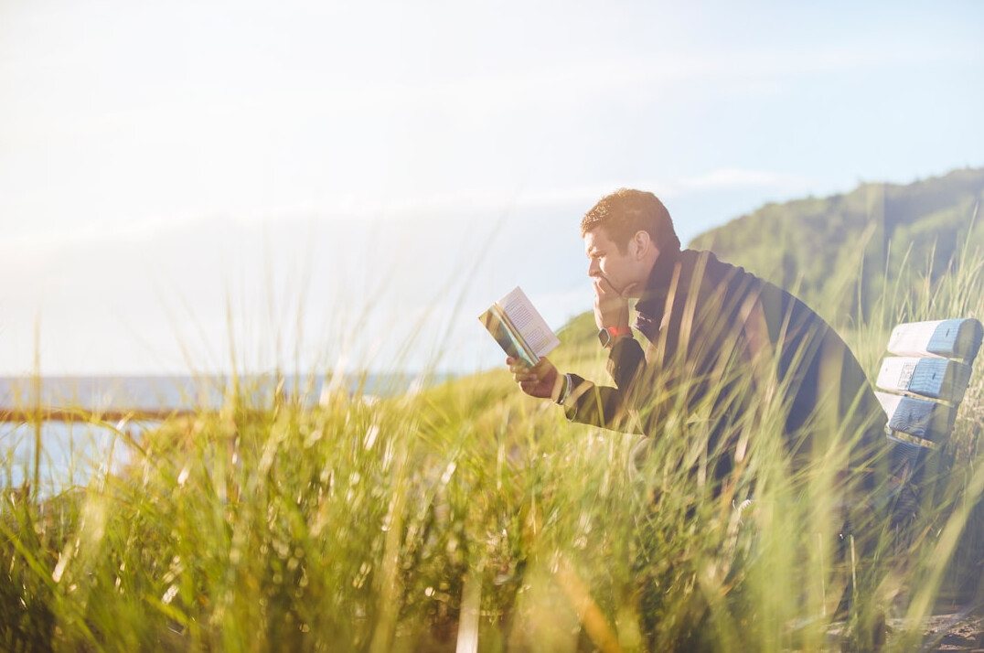 person reading self help book